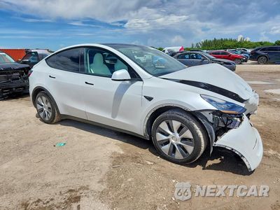 Czwarte zdjęcie samochodu z boku: 2023 TESLA MODEL Y VIN:7SAYGDEE9PA097981 - miniatura