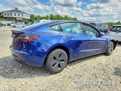 Trzecie zdjęcie samochodu z tyłu: 2023 TESLA MODEL 3 VIN:5YJ3E1EA1PF600379 - miniatura