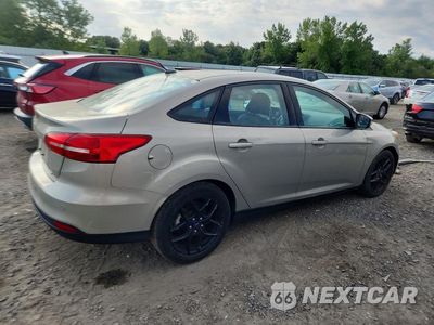 Trzecie zdjęcie samochodu z tyłu: 2016 FORD FOCUS SE VIN:1FADP3F22GL370906 - miniatura