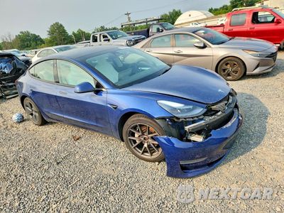 Czwarte zdjęcie samochodu z boku: 2022 TESLA MODEL 3 VIN:5YJ3E1EB6NF180401 - miniatura