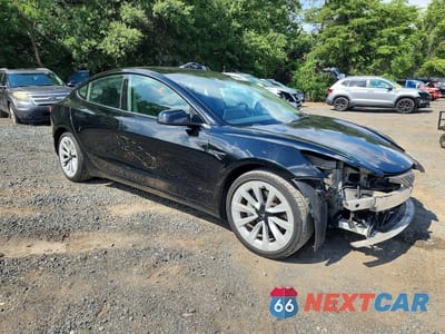 Czwarte zdjęcie samochodu z boku: 2023 TESLA MODEL 3 VIN:5YJ3E1EA3PF433667 - miniatura