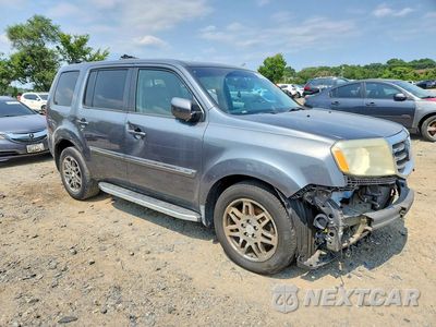 Czwarte zdjęcie samochodu z boku: 2012 HONDA PILOT TOURING VIN:5FNYF3H98CB024283 - miniatura