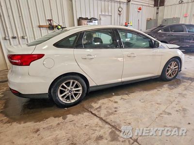 Trzecie zdjęcie samochodu z tyłu: 2016 FORD FOCUS SE VIN:1FADP3F23GL346310 - miniatura