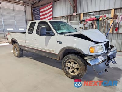 Czwarte zdjęcie samochodu z boku: 2002 FORD F150 VIN:1FTRX18L72NA83360 - miniatura