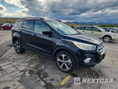 Czwarte zdjęcie samochodu z boku: 2017 FORD ESCAPE SE VIN:1FMCU9G99HUD80661 - miniatura