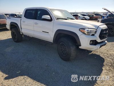 Czwarte zdjęcie samochodu z boku: 2021 TOYOTA TACOMA TRD OFF-ROAD VIN:3TMAZ5CNXMM141563 - miniatura