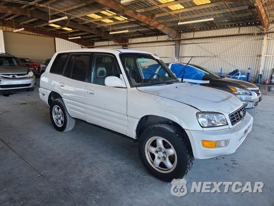 Czwarte zdjęcie samochodu z boku: 1999 TOYOTA RAV4 BASE VIN:JT3HP10V8X7144157 - miniatura