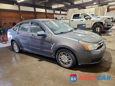 Czwarte zdjęcie samochodu z boku: 2010 FORD FOCUS SE VIN:1FAHP3FNXAW140810 - miniatura