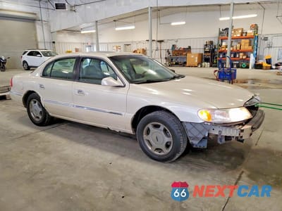 Czwarte zdjęcie samochodu z boku: 2002 LINCOLN CONTINENTAL VIN:1LNHM97V12Y650694 - miniatura