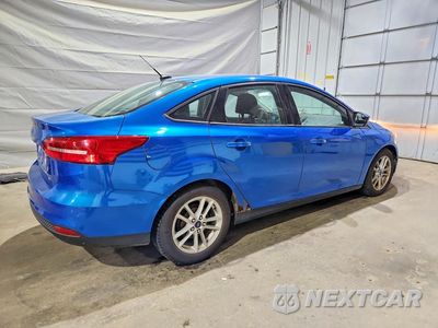 Trzecie zdjęcie samochodu z tyłu: 2016 FORD FOCUS SE VIN:1FADP3F23GL248118 - miniatura