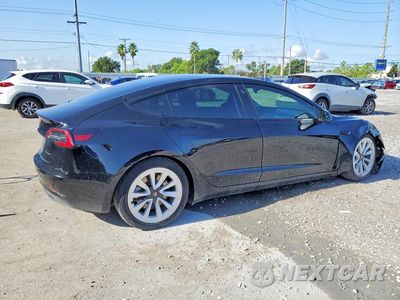 Trzecie zdjęcie samochodu z tyłu: 2022 TESLA MODEL 3 VIN:5YJ3E1EB4NF257217 - miniatura