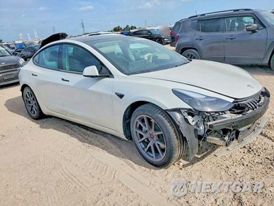 Czwarte zdjęcie samochodu z boku: 2021 TESLA MODEL 3 VIN:5YJ3E1EA2MF097473 - miniatura