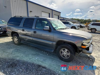 Czwarte zdjęcie samochodu z boku: 2001 CHEVROLET SUBURBAN C1500 VIN:3GNEC16T71G219031 - miniatura