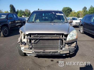 Piąte zdjęcie samochodu w środku: 2004 HONDA PILOT EXL VIN:2HKYF18704H500774 - miniatura