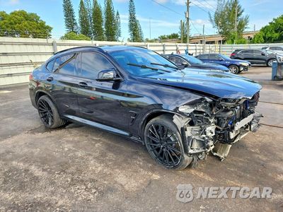 Czwarte zdjęcie samochodu z boku: 2022 BMW X4 M VIN:5YM23EC08N9J40641 - miniatura