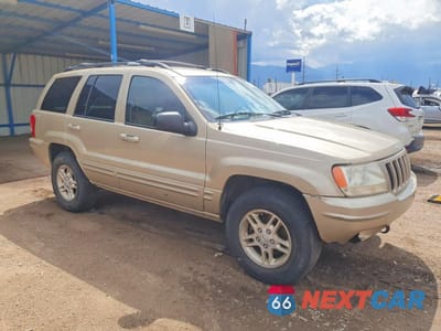Czwarte zdjęcie samochodu z boku: 1999 JEEP GRAND CHEROKEE LIMITED VIN:1J4GW68NXXC696921 - miniatura