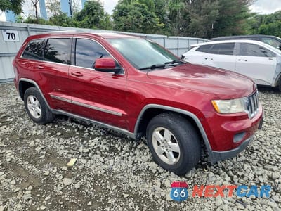 Czwarte zdjęcie samochodu z boku: 2012 JEEP GRAND CHEROKEE LAREDO VIN:1C4RJFAG6CC174208 - miniatura