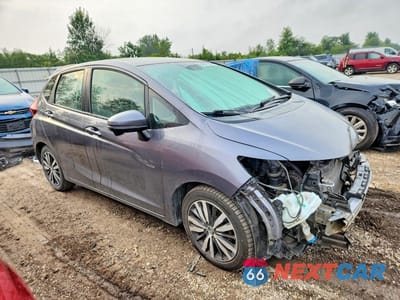 Czwarte zdjęcie samochodu z boku: 2017 HONDA FIT EX VIN:3HGGK5H74HM704560 - miniatura