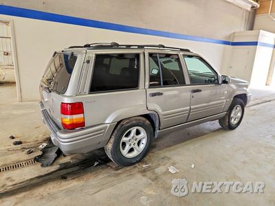 Piąte zdjęcie samochodu w środku: 1998 JEEP GRAND CHEROKEE LIMITED 5.9L VIN:1J4GZ88Z8WC118109 - miniatura