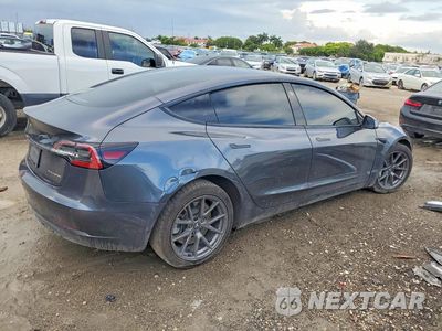 Trzecie zdjęcie samochodu z tyłu: 2021 TESLA MODEL 3 VIN:5YJ3E1EB2MF091410 - miniatura