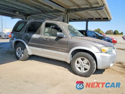 Czwarte zdjęcie samochodu z boku: 2006 FORD ESCAPE HEV VIN:1FMCU96H56KC06300 - miniatura