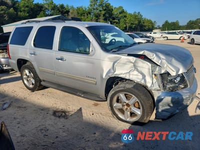 Czwarte zdjęcie samochodu z boku: 2011 CHEVROLET TAHOE C1500 LT VIN:1GNSCBE05BR270285 - miniatura