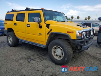 Czwarte zdjęcie samochodu z boku: 2003 HUMMER H2 VIN:5GRGN23U93H121690 - miniatura