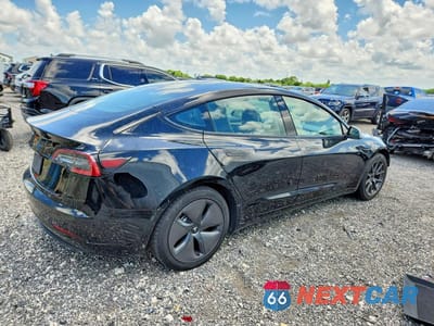 Trzecie zdjęcie samochodu z tyłu: 2023 TESLA MODEL 3 VIN:5YJ3E1EA4PF458903 - miniatura