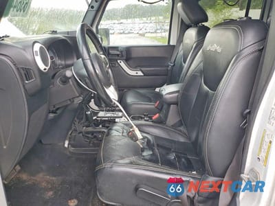 Zdjęcie 7 z 13 samochodu: 2014 JEEP WRANGLER UNLIMITED SAHARA VIN:1C4HJWEG8EL182450 - miniatura