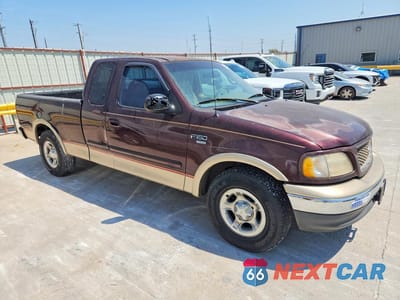 Czwarte zdjęcie samochodu z boku: 2000 FORD F150 VIN:1FTRX17L2YKA72908 - miniatura