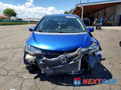Piąte zdjęcie samochodu w środku: 2016 HONDA FIT LX VIN:JHMGK5H51GX014043 - miniatura