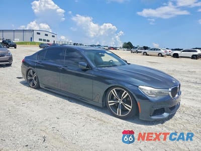 Czwarte zdjęcie samochodu z boku: 2016 BMW 740 I VIN:WBA7E2C57GG547414 - miniatura