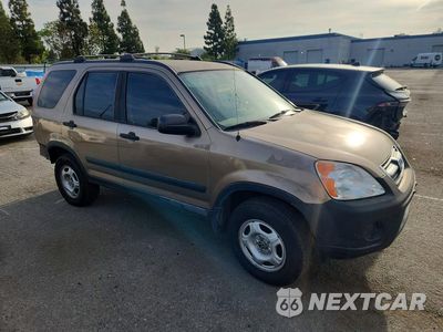 Czwarte zdjęcie samochodu z boku: 2004 HONDA CR-V LX VIN:JHLRD68404C007799 - miniatura