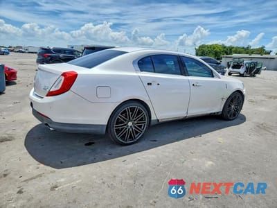 Trzecie zdjęcie samochodu z tyłu: 2013 LINCOLN MKS VIN:1LNHL9EK8DG616370 - miniatura