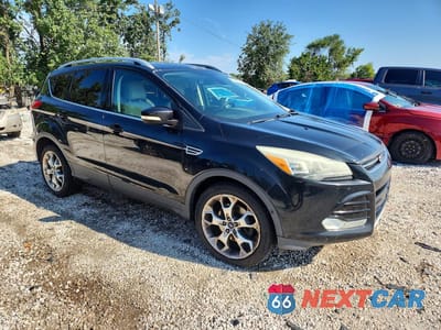 Czwarte zdjęcie samochodu z boku: 2014 FORD ESCAPE TITANIUM VIN:1FMCU0J99EUA94583 - miniatura