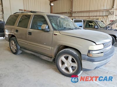 Czwarte zdjęcie samochodu z boku: 2001 CHEVROLET TAHOE C1500 VIN:1GNEC13T41J139026 - miniatura