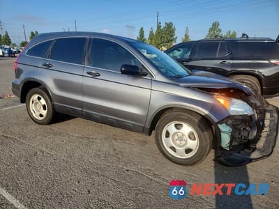 Czwarte zdjęcie samochodu z boku: 2010 HONDA CR-V LX VIN:JHLRE4H30AC015017 - miniatura