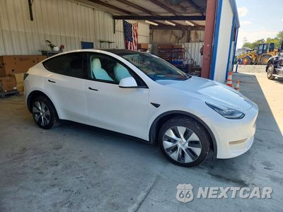 Czwarte zdjęcie samochodu z boku: 2023 TESLA MODEL Y VIN:7SAYGDEE9PA054208 - miniatura