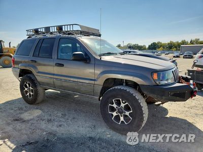 Czwarte zdjęcie samochodu z boku: 1999 JEEP GRAND CHEROKEE LAREDO VIN:1J4GW58S5XC687799 - miniatura