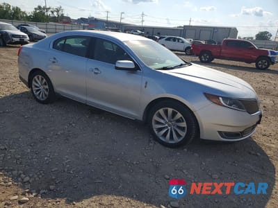 Czwarte zdjęcie samochodu z boku: 2015 LINCOLN MKS VIN:1LNHL9EK8FG604299 - miniatura