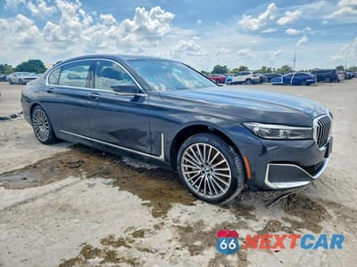 Czwarte zdjęcie samochodu z boku: 2022 BMW 750 XI VIN:WBA7U2C02NCJ91319 - miniatura