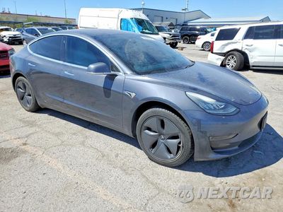 Czwarte zdjęcie samochodu z boku: 2019 TESLA MODEL 3 VIN:5YJ3E1EA1KF312144 - miniatura