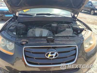 Zdjęcie 12 z 13 samochodu: 2011 HYUNDAI SANTA FE GLS VIN:5XYZG4AG9BG019665 - miniatura