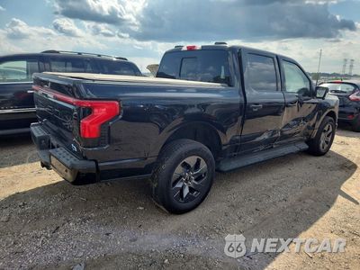 Trzecie zdjęcie samochodu z tyłu: 2025 FORD F150 LIGHTNING LARIAT VIN:1FT6W5L77SWG11027 - miniatura