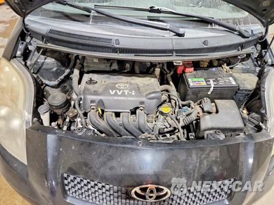 Zdjęcie 11 z 12 samochodu: 2008 TOYOTA YARIS BASE VIN:JTDJT923785212626 - miniatura