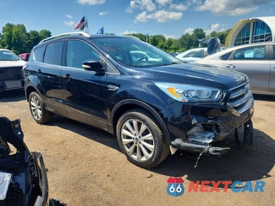 Czwarte zdjęcie samochodu z boku: 2017 FORD ESCAPE TITANIUM VIN:1FMCU9JD7HUE62613 - miniatura