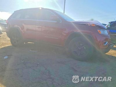 Czwarte zdjęcie samochodu z boku: 2014 JEEP GRAND CHEROKEE LAREDO VIN:1C4RJFAG9EC194245 - miniatura