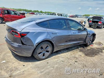 Trzecie zdjęcie samochodu z tyłu: 2023 TESLA MODEL 3 VIN:5YJ3E1EA2PF517429 - miniatura