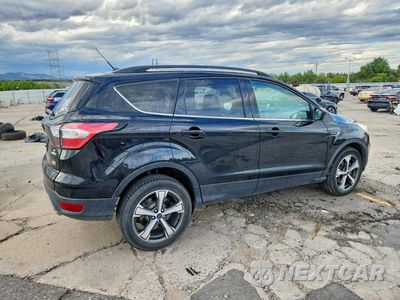 Trzecie zdjęcie samochodu z tyłu: 2017 FORD ESCAPE SE VIN:1FMCU9G99HUD80661 - miniatura