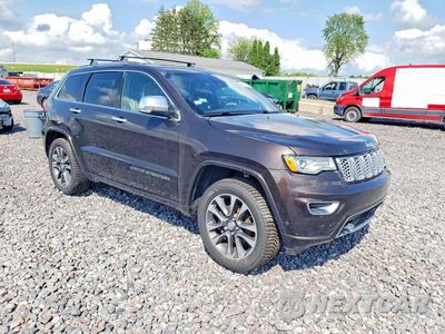 Czwarte zdjęcie samochodu z boku: 2017 JEEP GRAND CHEROKEE OVERLAND VIN:1C4RJFCG6HC695790 - miniatura
